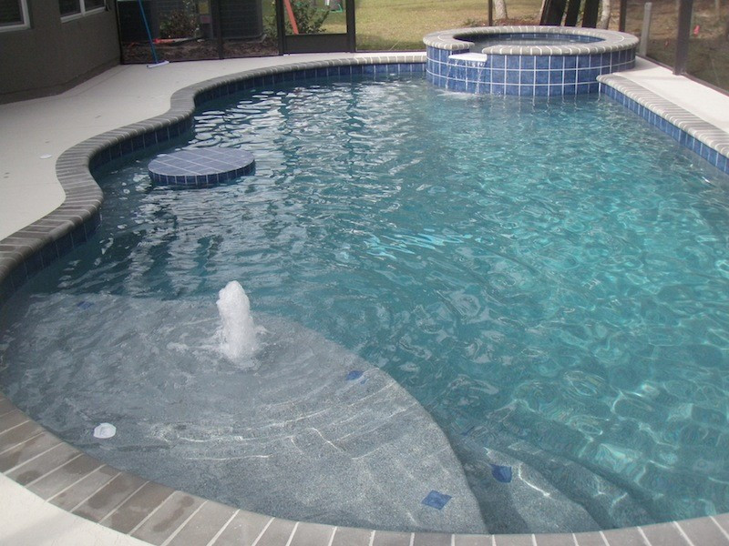047 - Freeform Sunshelf Pool and Spa with Table