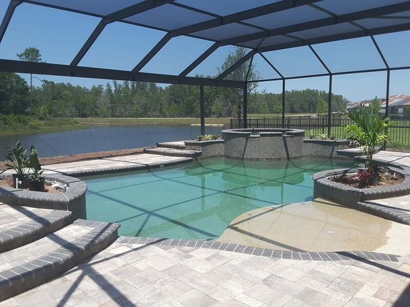 437 - Freeform Pool with Sunshelf and Raised Spa